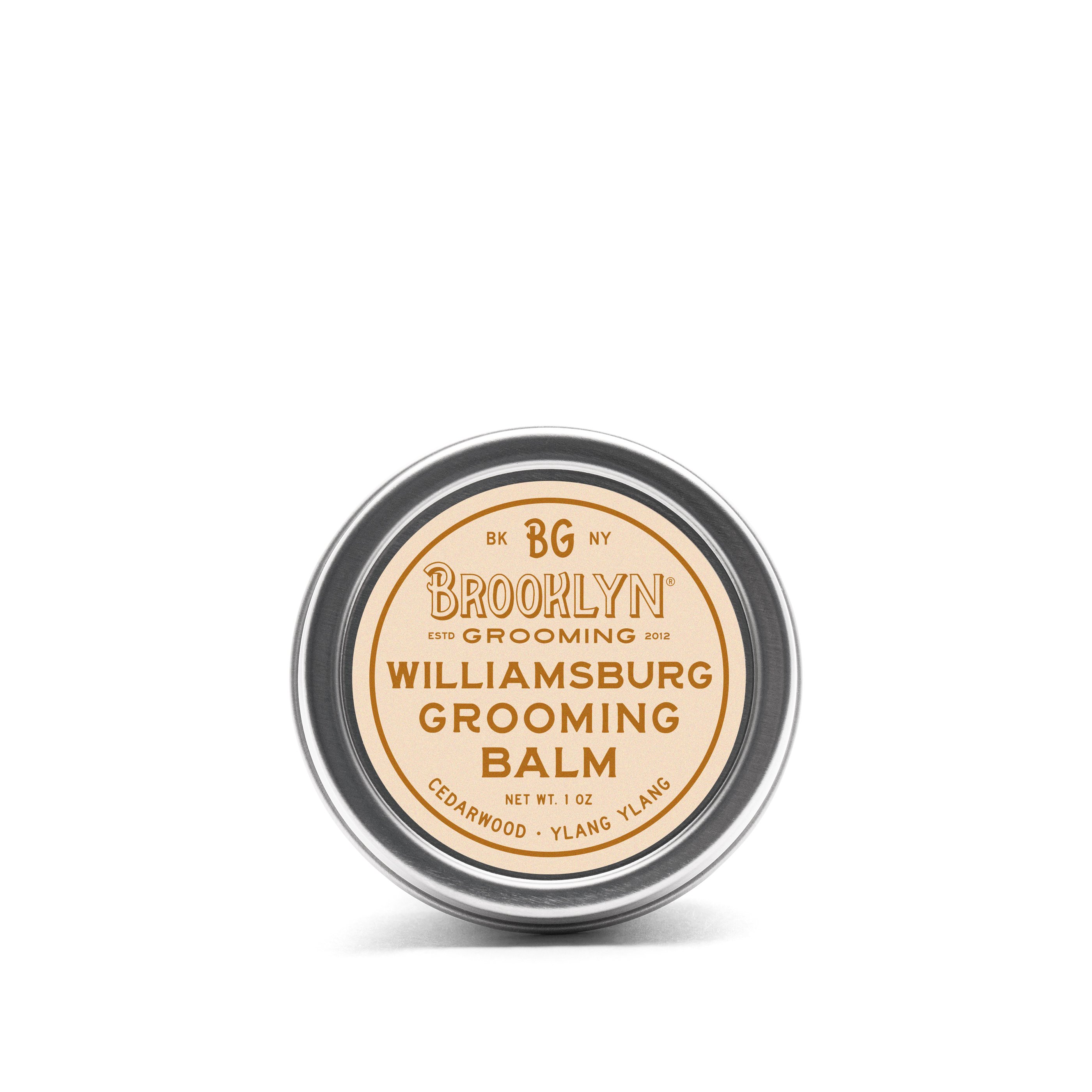 Williamsburg Grooming Balm in a sleek aluminum tin, showcasing its natural ingredients and woodsy scent.