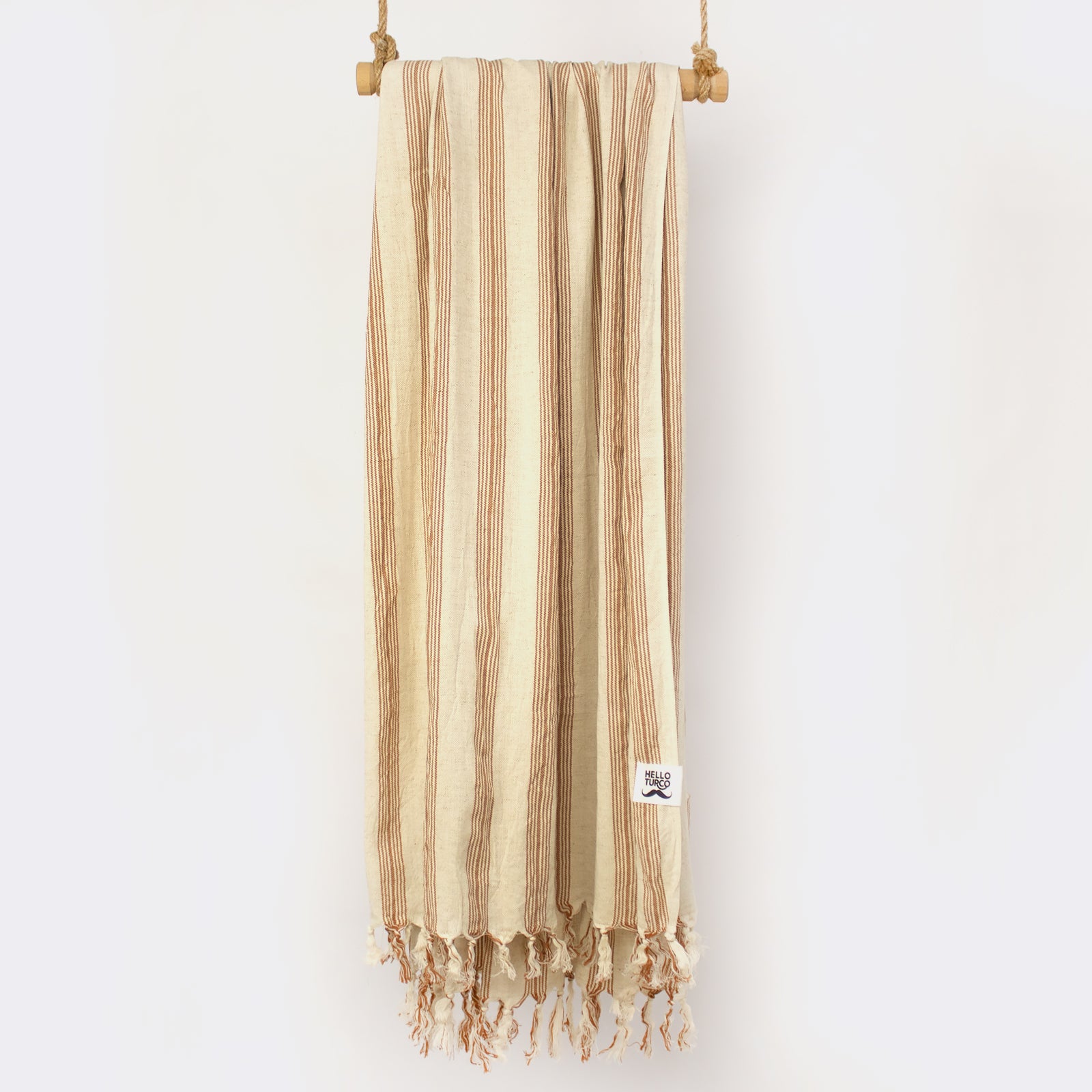 Ada Handwoven towel in earthy tones, showcasing traditional Turkish peshtemal design and organic cotton texture.