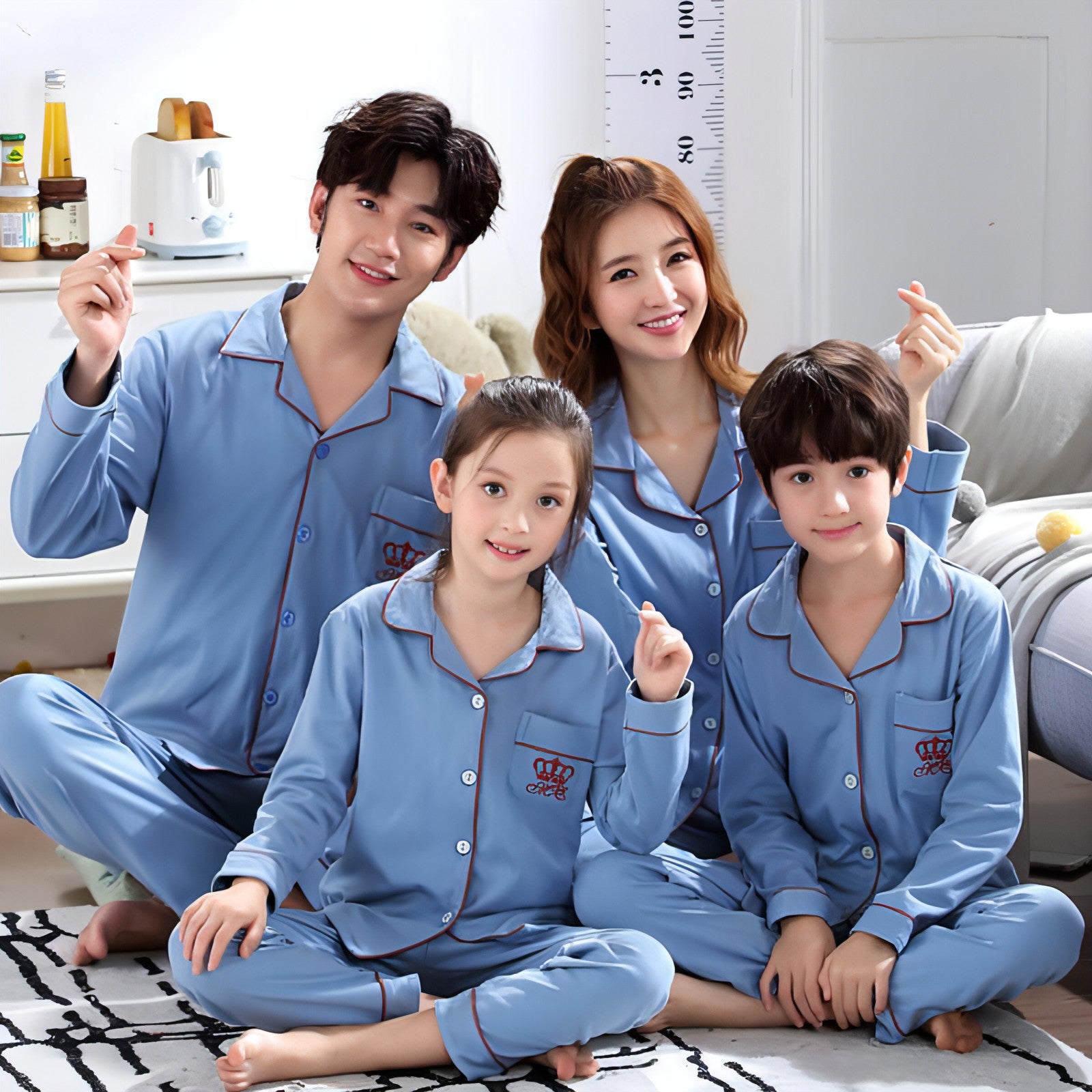 A pair of matching long sleeve cotton pajamas for parents and children, showcasing a cozy and stylish design perfect for family bonding.