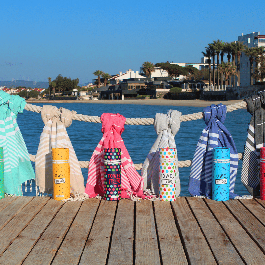 Turquoise Malibu Hammam Towel made from 100% cotton, elegantly packaged in a recycled gift box, perfect for travel and eco-conscious consumers.