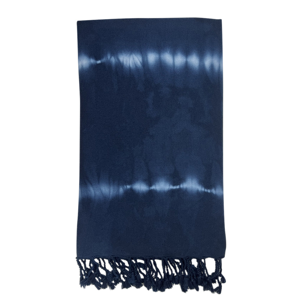A beautifully crafted Navy Tie Dye Turkish Beach Towel, showcasing vibrant patterns and handmade craftsmanship, ideal for beach or bath use.