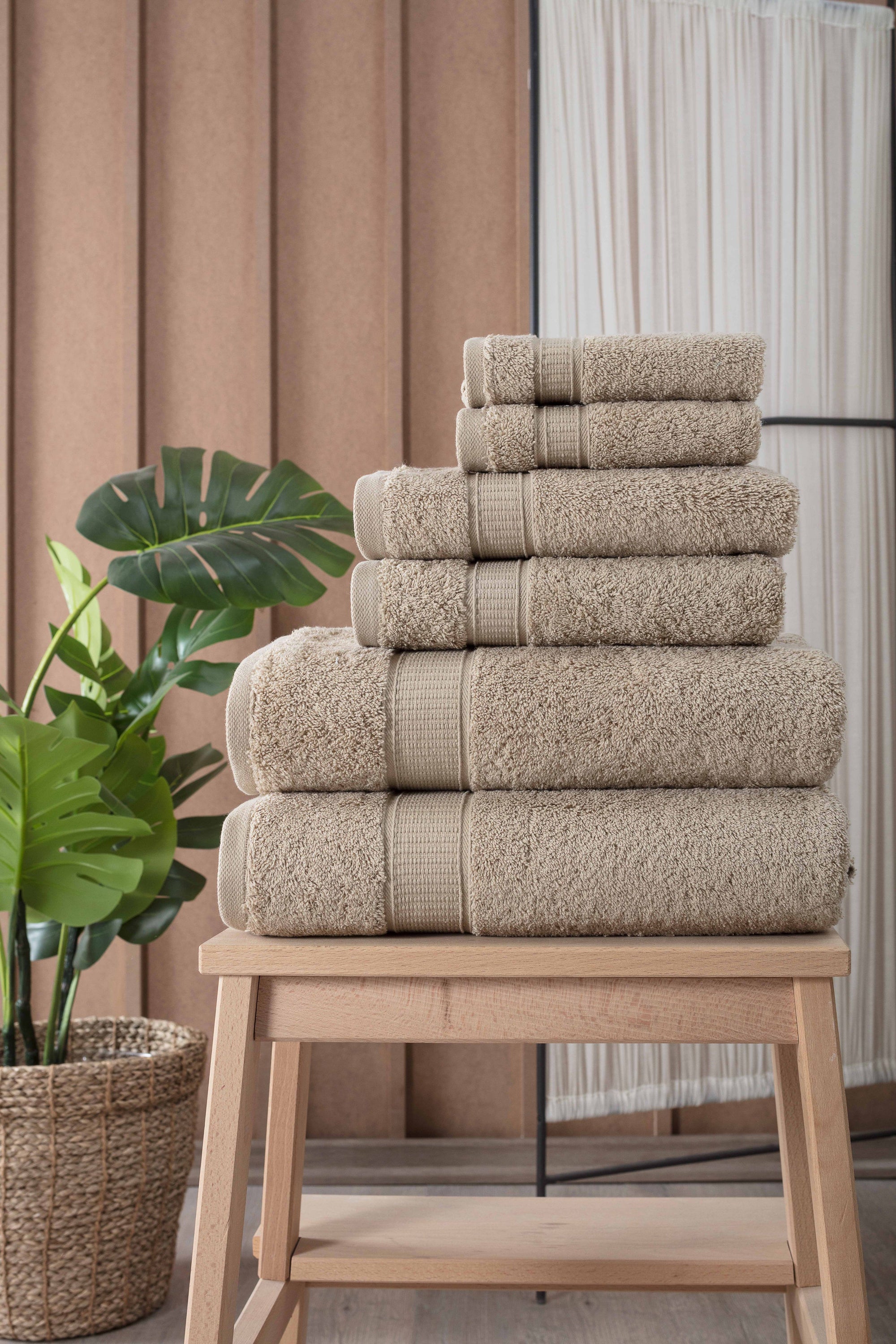 A luxurious set of 6 Turkish cotton bath towels in vibrant colors, showcasing their softness and dobby border design.