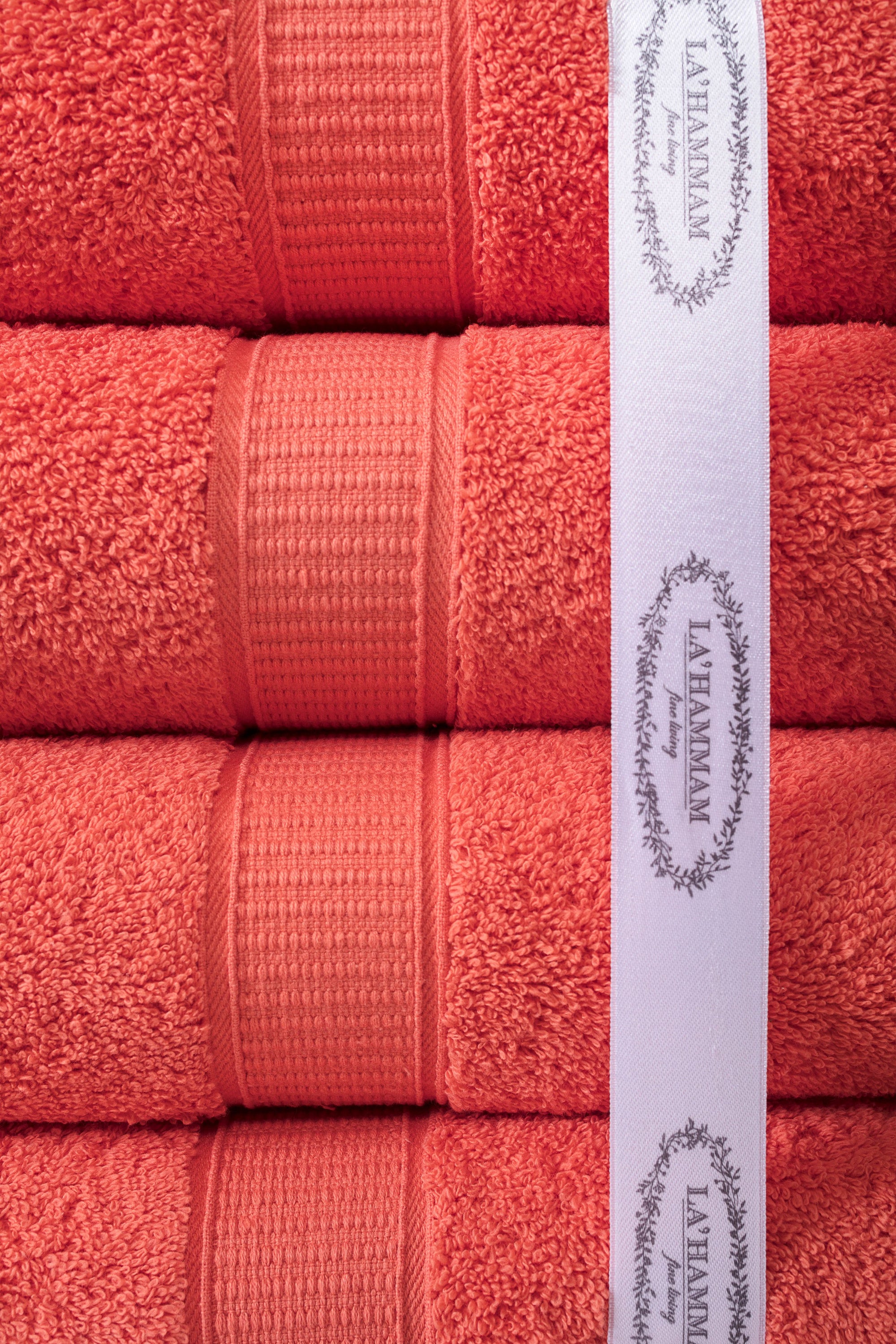 A luxurious set of 6 Turkish cotton bath towels in vibrant colors, showcasing their softness and dobby border design.