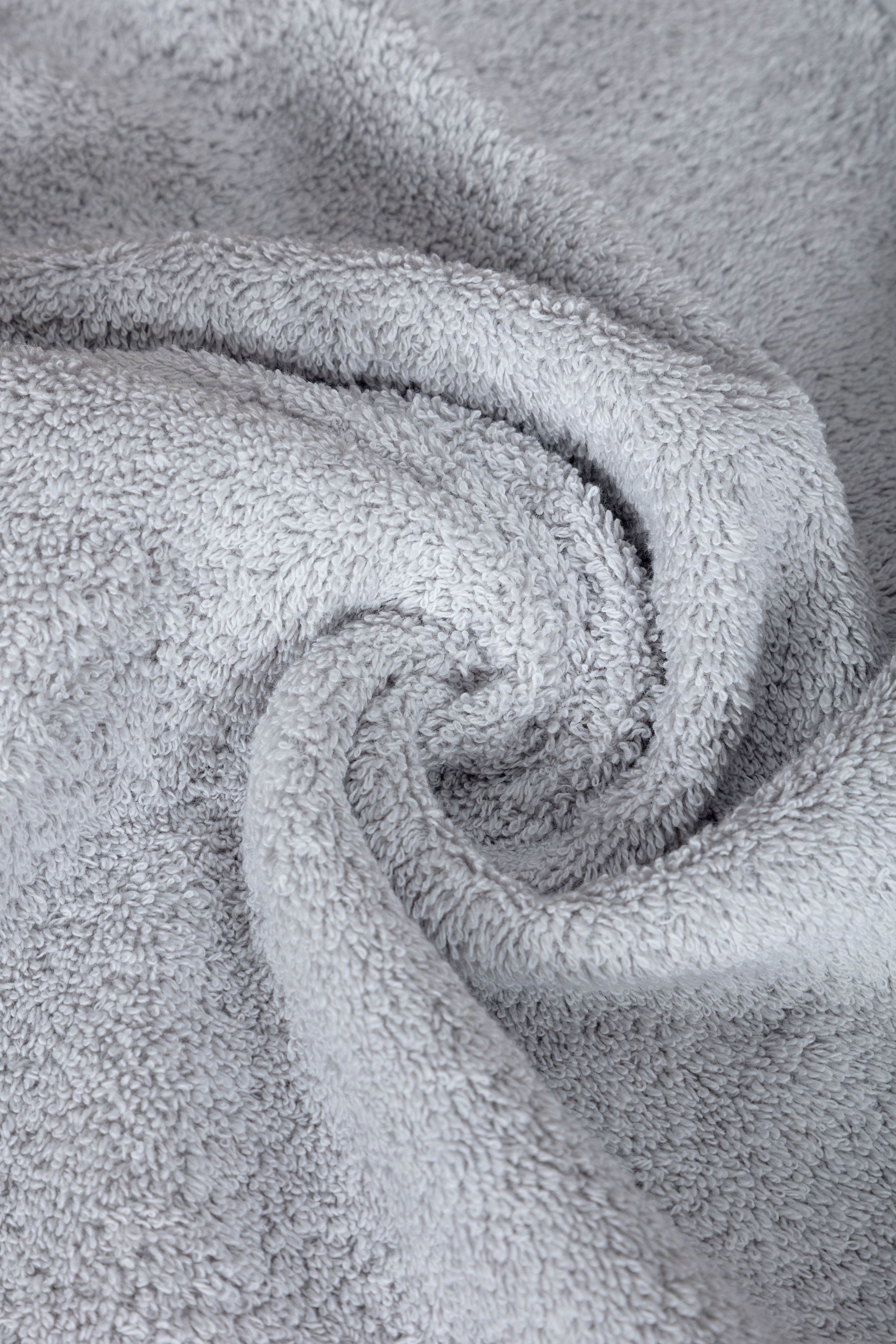 A luxurious set of 6 Turkish cotton bath towels in vibrant colors, showcasing their softness and dobby border design.