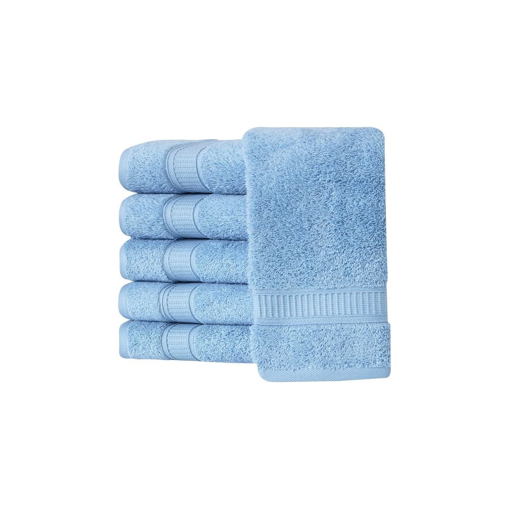 A set of six luxurious Turkish cotton hand towels in various vibrant colors, showcasing their soft texture and elegant dobby border design.