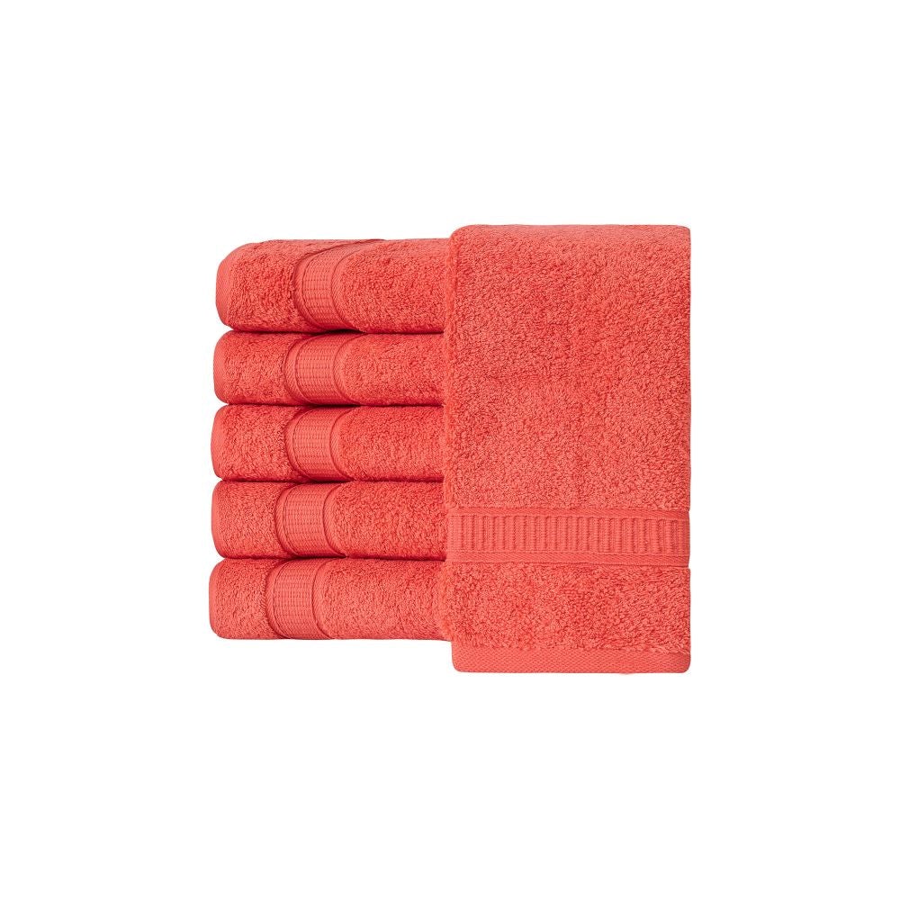 A set of six luxurious Turkish cotton hand towels in various vibrant colors, showcasing their soft texture and elegant dobby border design.