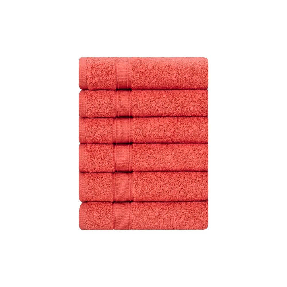 A set of six luxurious Turkish cotton hand towels in various vibrant colors, showcasing their soft texture and elegant dobby border design.