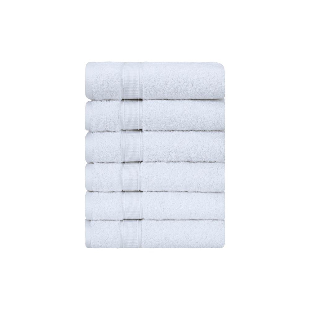 A set of six luxurious Turkish cotton hand towels in various vibrant colors, showcasing their soft texture and elegant dobby border design.