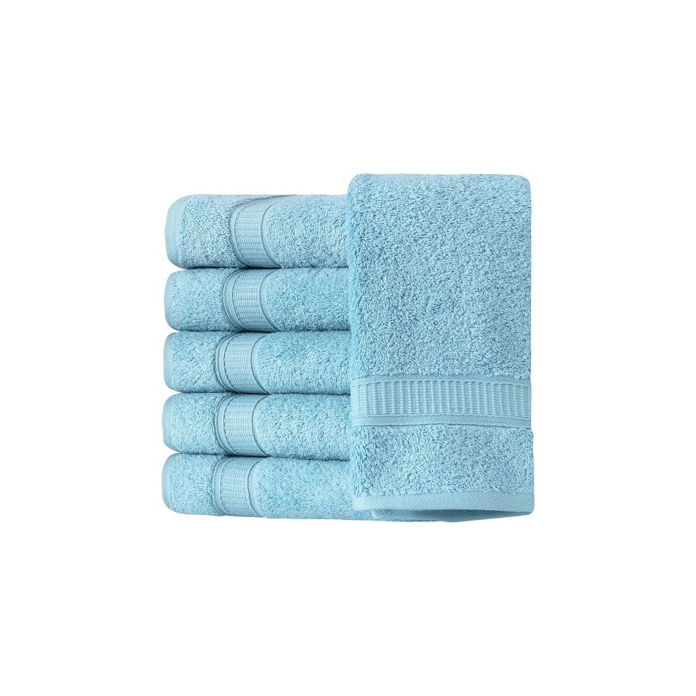 A set of six luxurious Turkish cotton hand towels in various vibrant colors, showcasing their soft texture and elegant dobby border design.