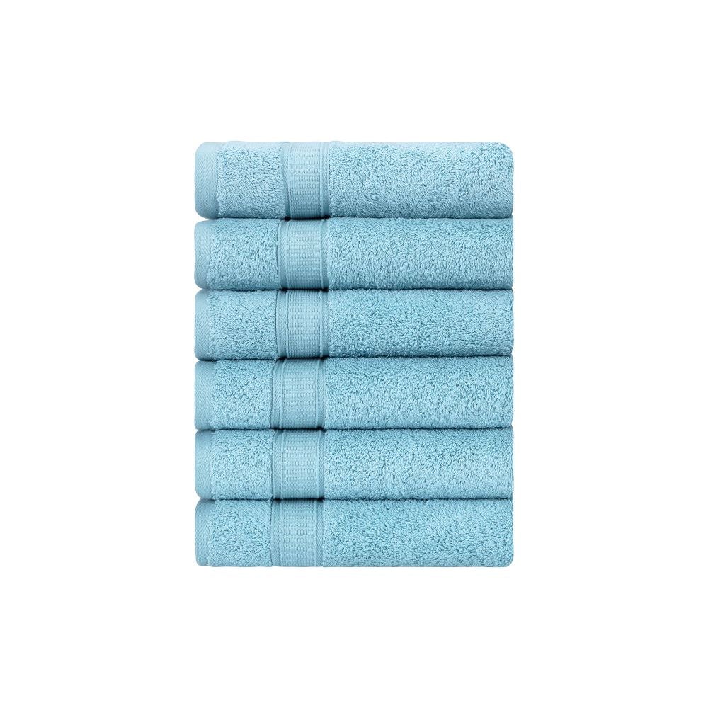 A set of six luxurious Turkish cotton hand towels in various vibrant colors, showcasing their soft texture and elegant dobby border design.