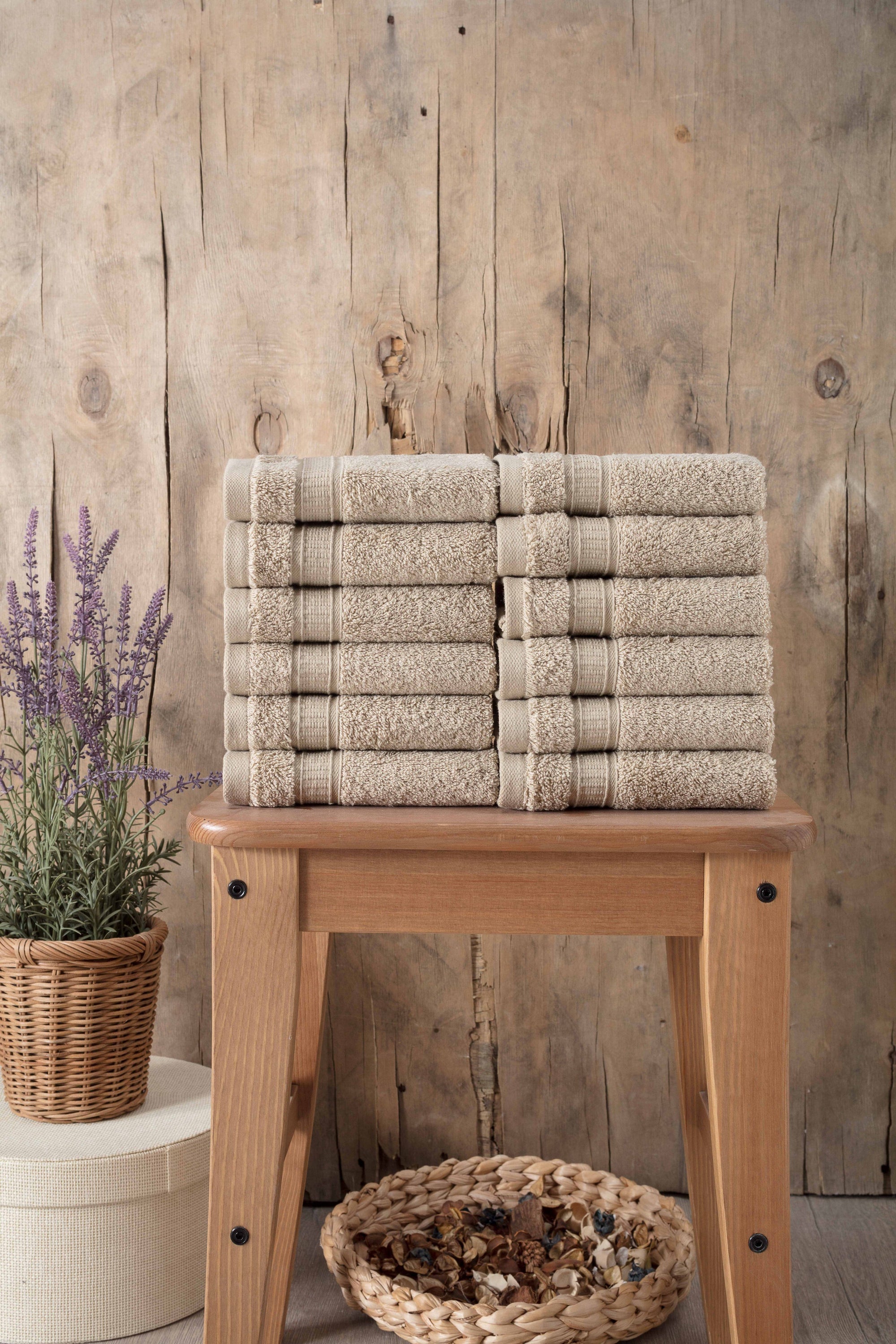 A set of 12 luxurious Turkish cotton washcloths in various vibrant colors, showcasing their softness and dobby border design.