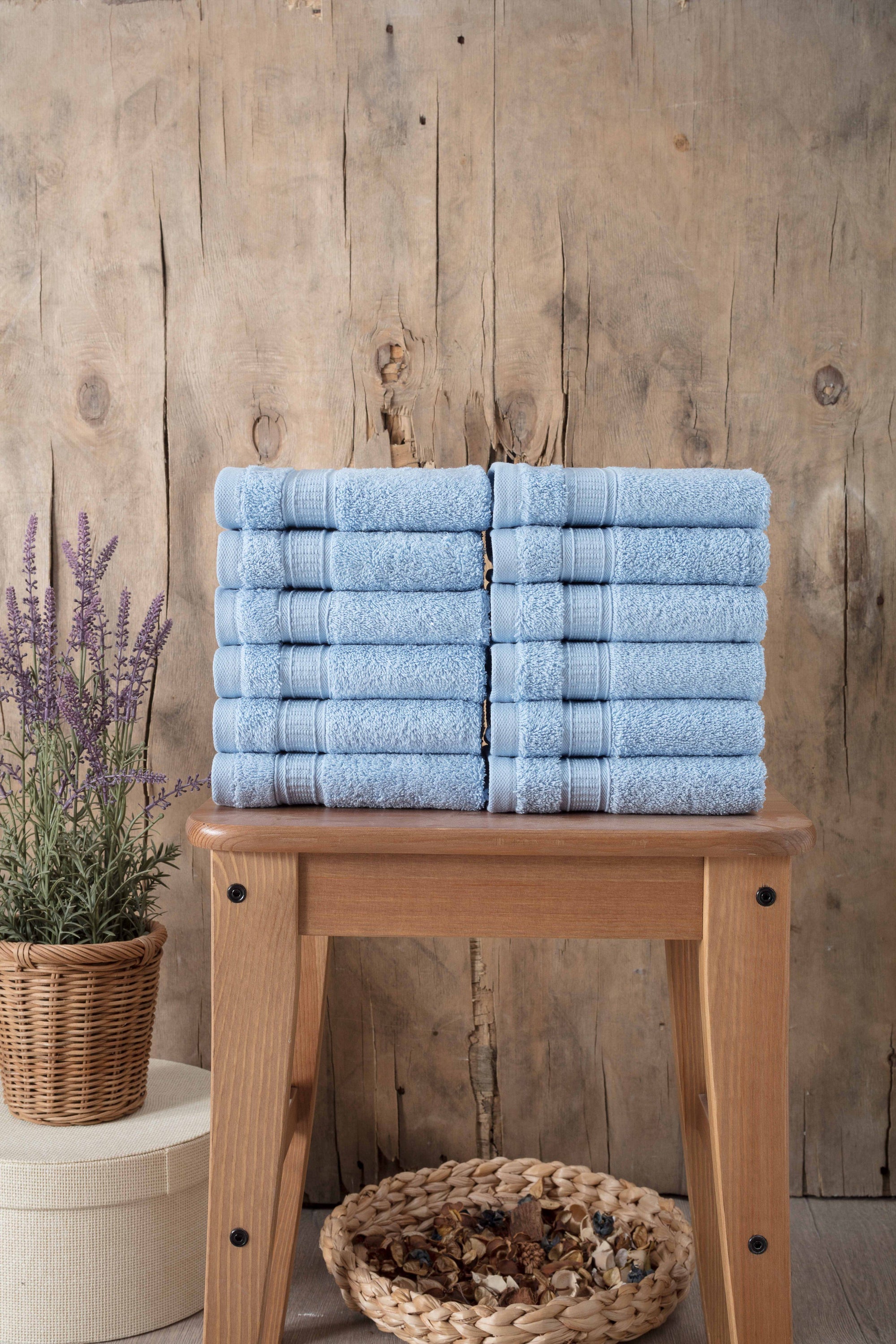 A set of 12 luxurious Turkish cotton washcloths in various vibrant colors, showcasing their softness and dobby border design.