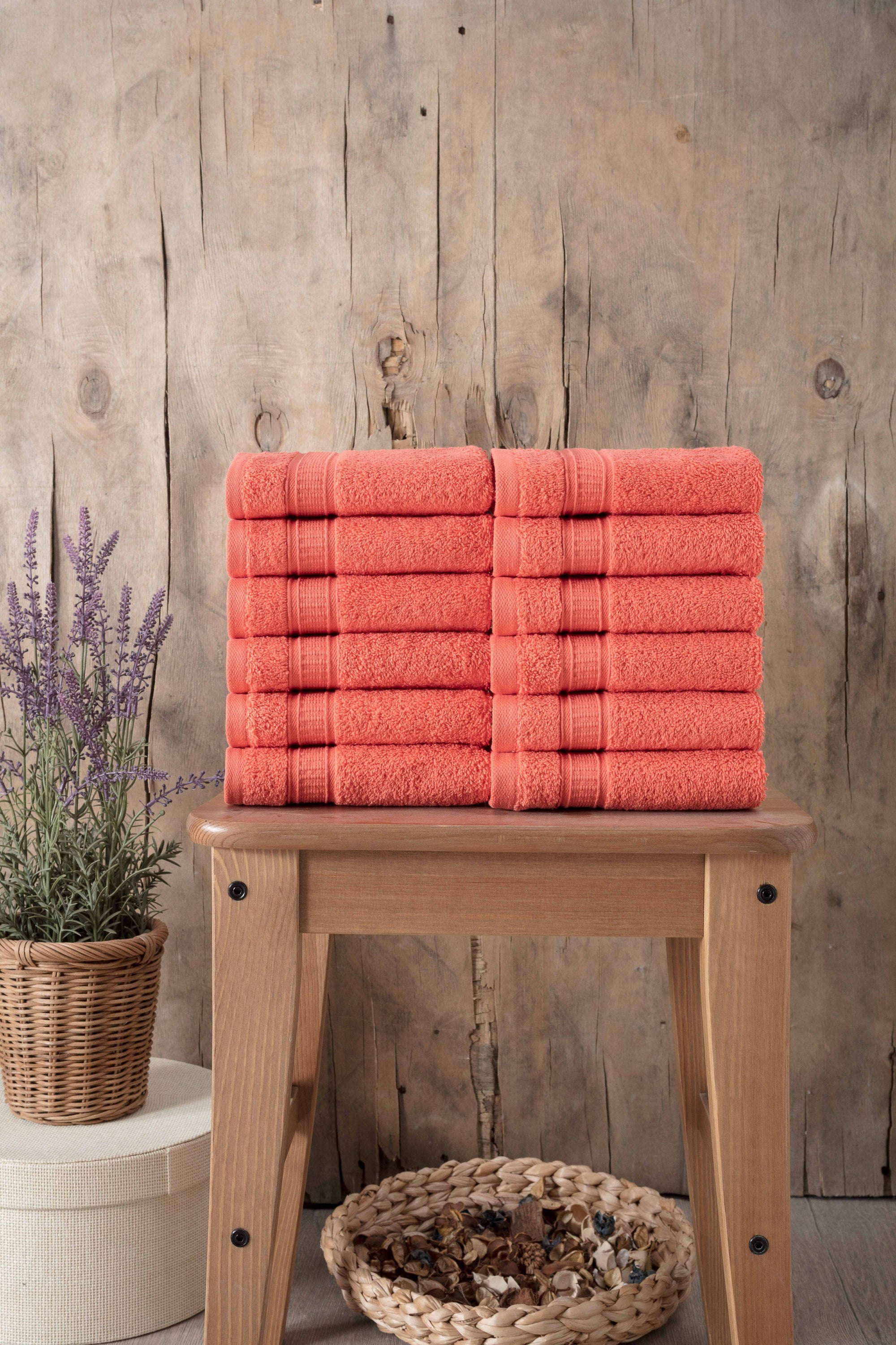 A set of 12 luxurious Turkish cotton washcloths in various vibrant colors, showcasing their softness and dobby border design.