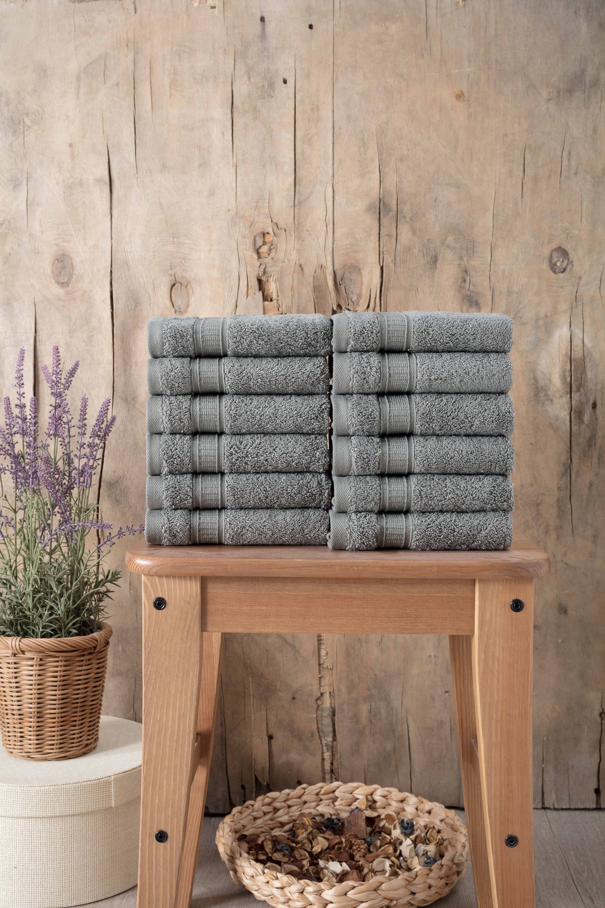 A set of 12 luxurious Turkish cotton washcloths in various vibrant colors, showcasing their softness and dobby border design.