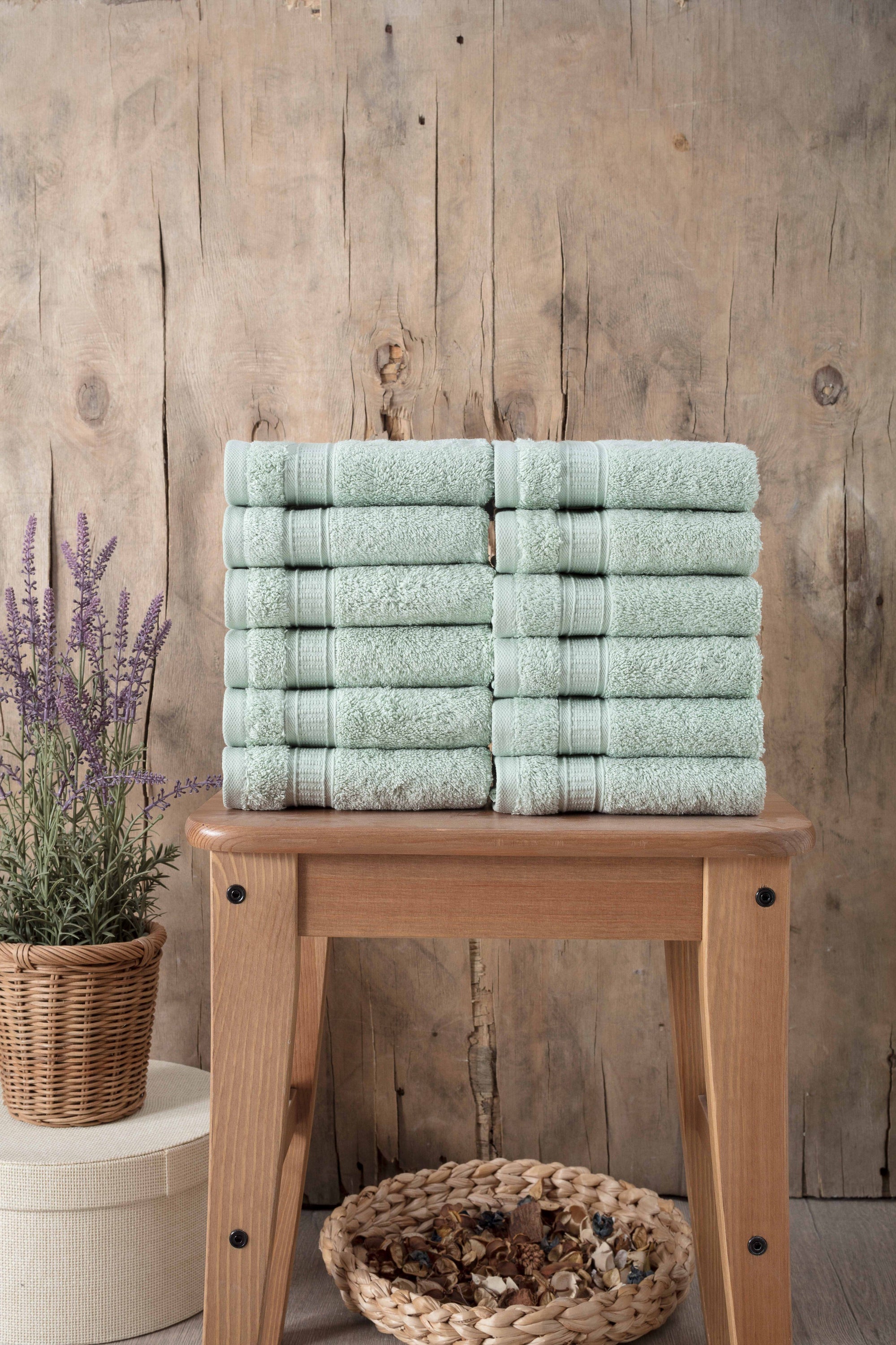 A set of 12 luxurious Turkish cotton washcloths in various vibrant colors, showcasing their softness and dobby border design.