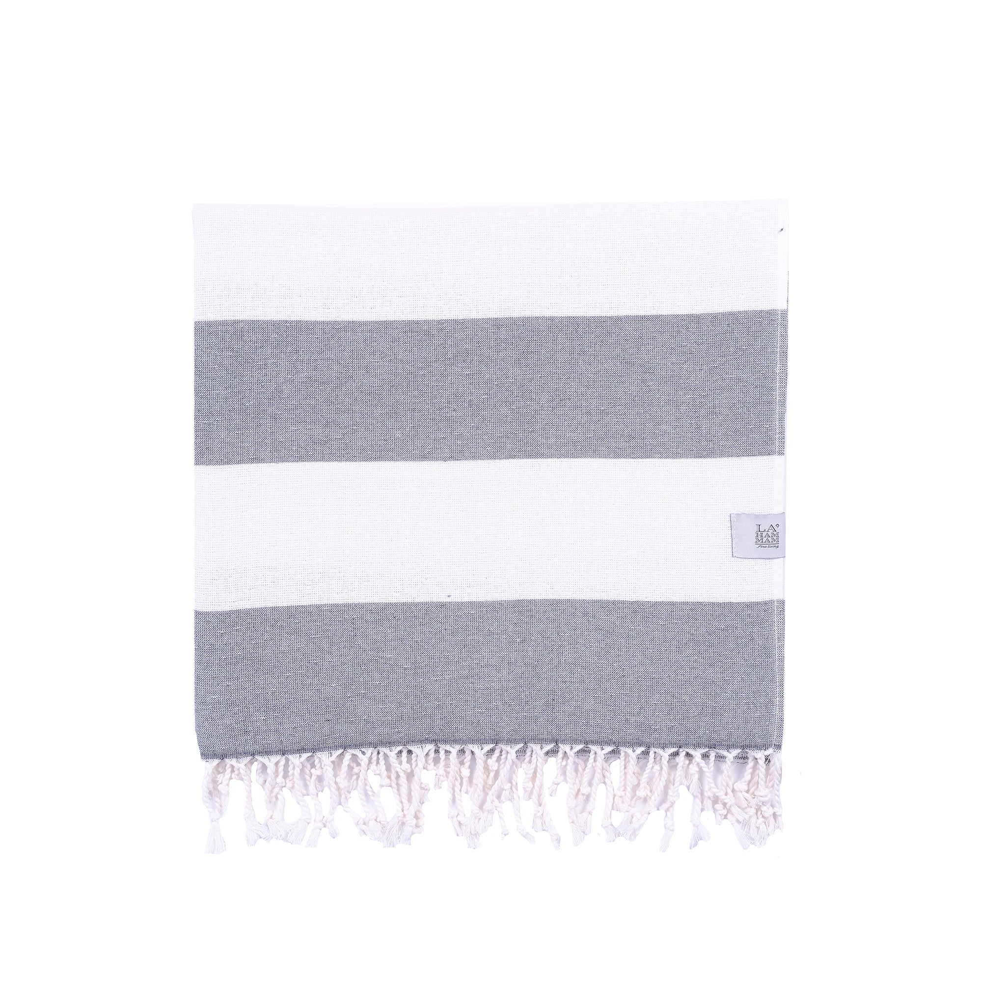Violet Beach Towel made of soft Turkish cotton with white fringes, perfect for beach or home use.