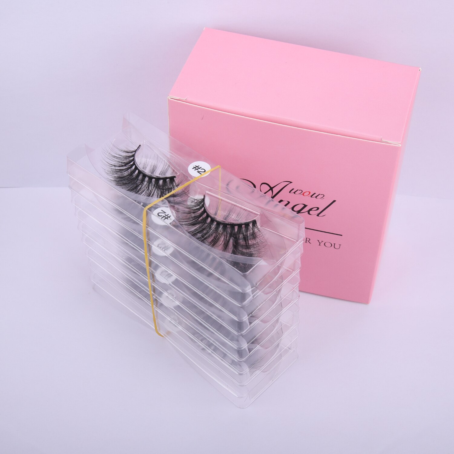 A collection of 10 pairs of natural 3D false eyelashes, showcasing their soft synthetic hair and flexible black cotton bands.