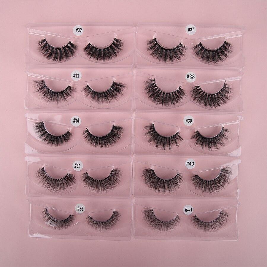 A collection of 10 pairs of natural 3D false eyelashes, showcasing their soft synthetic hair and flexible black cotton bands.