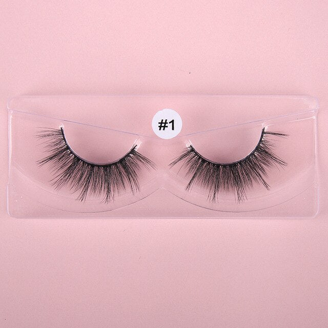 A collection of 10 pairs of natural 3D false eyelashes, showcasing their soft synthetic hair and flexible black cotton bands.