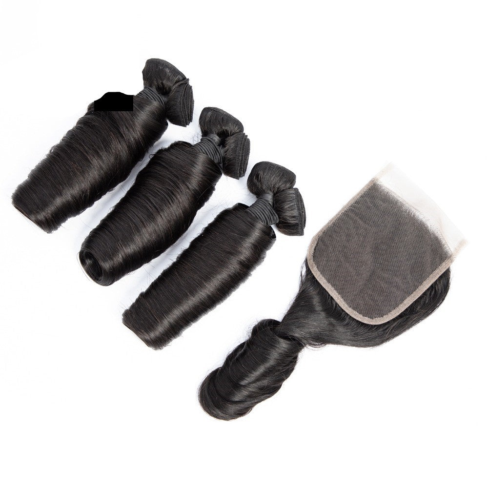10A Grade 3/4 Straight Bouncy Curl Fumi Human Hair bundles with 4x4 lace closure, showcasing natural color and texture.
