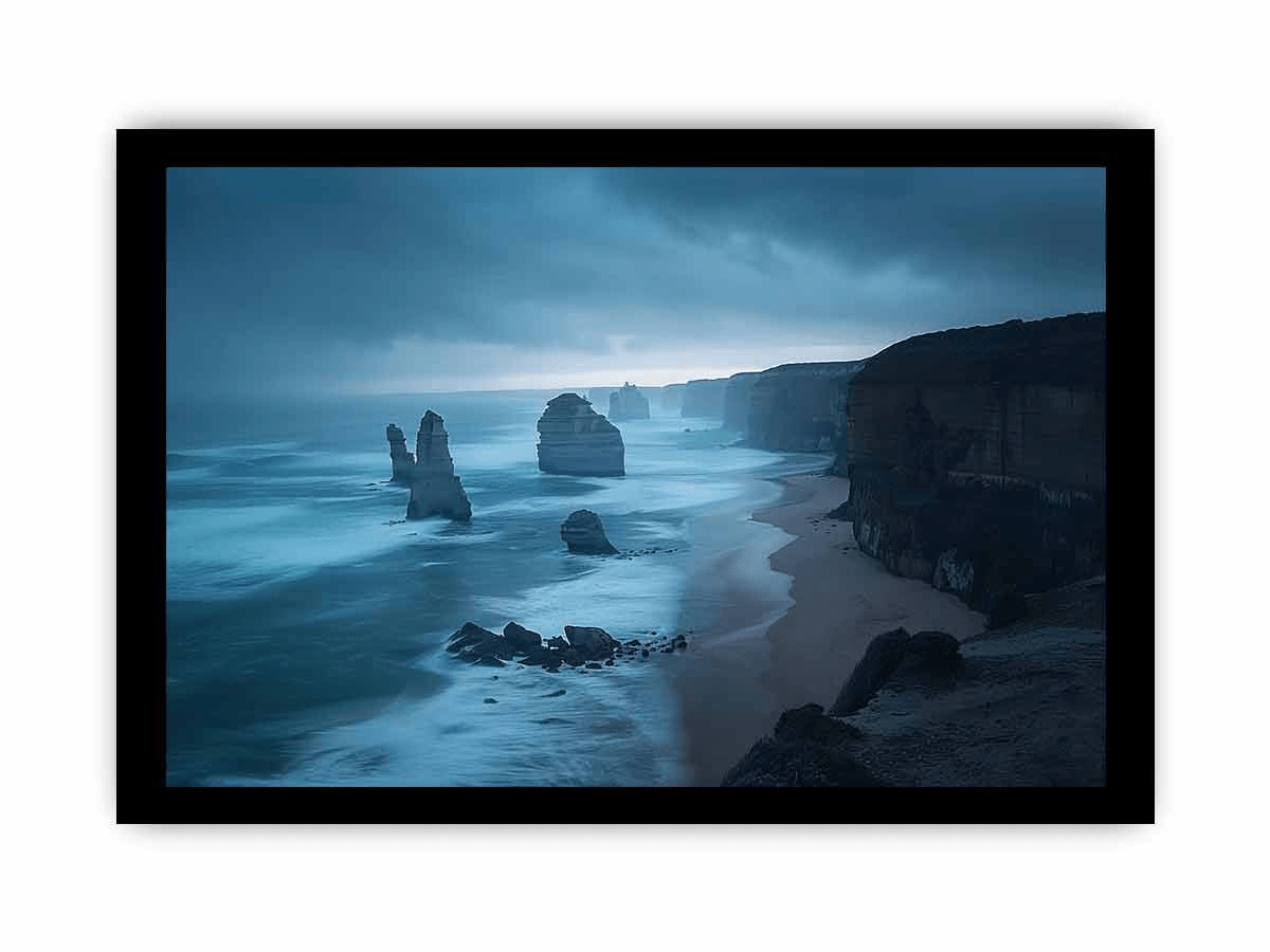 A beautifully framed print of the 12 Apostles, showcasing vibrant colors and intricate details, set in a matte black or white frame.