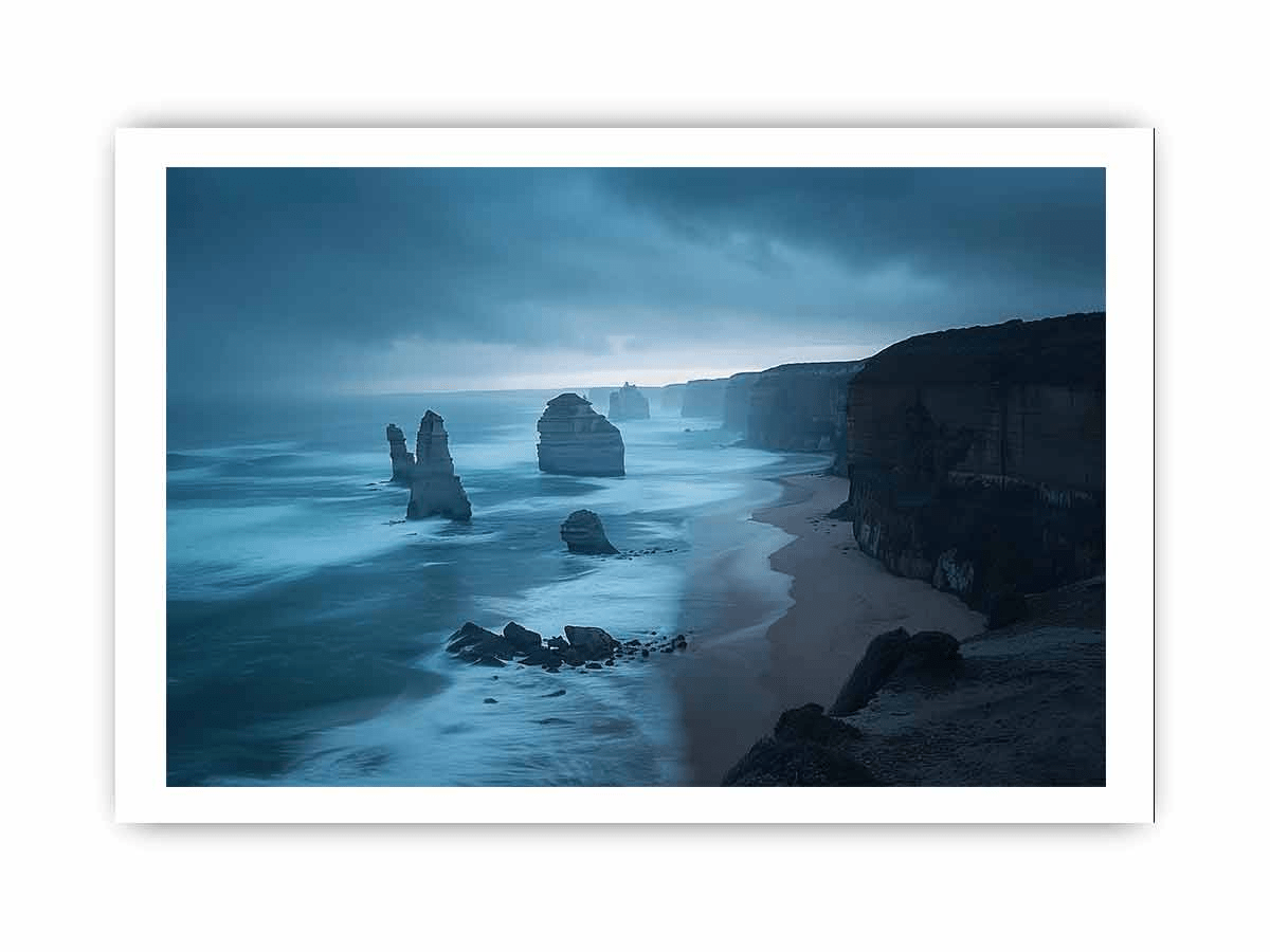 A beautifully framed print of the 12 Apostles, showcasing vibrant colors and intricate details, set in a matte black or white frame.