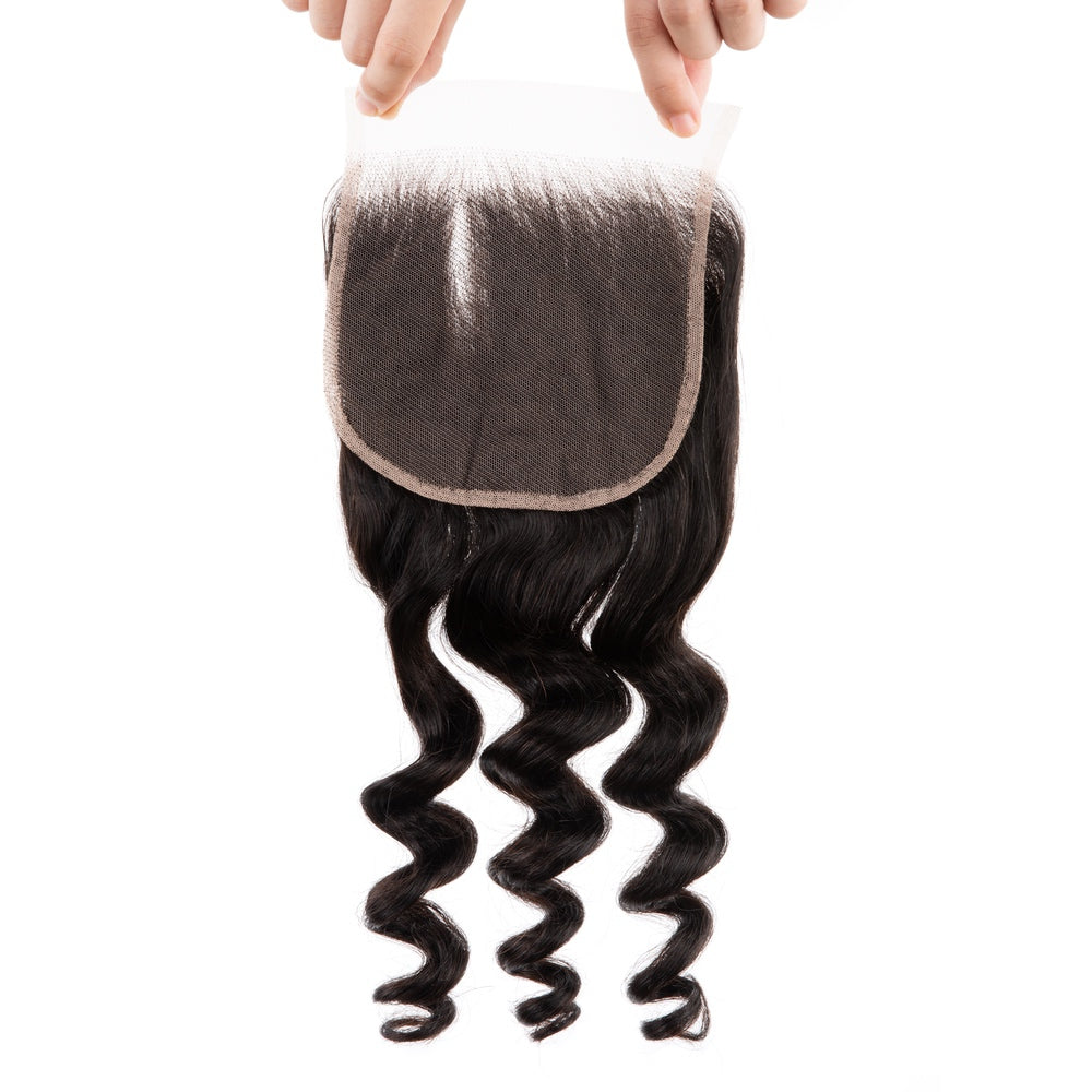4x4 Premium Human Hair Loose Deep Lace Closure showcasing its natural texture and quality.