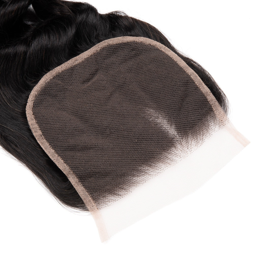 4x4 Premium Human Hair Loose Deep Lace Closure showcasing its natural texture and quality.