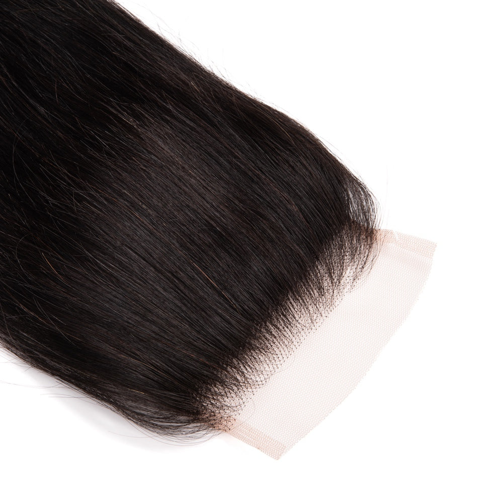 4X4 Straight Hair Free Part Closure made from 100% human hair, showcasing its natural texture and lace material.