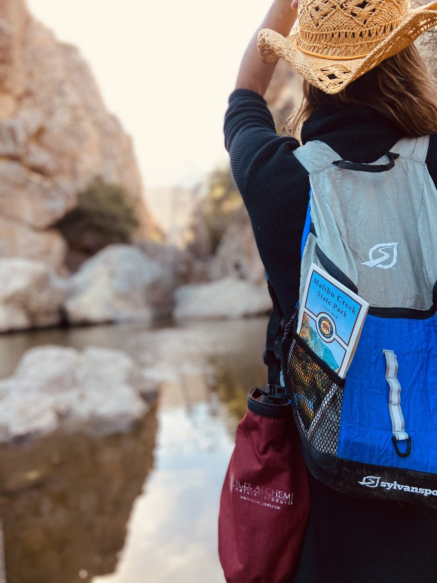 Adventure Bag containing essential outdoor protection and hydration products, designed for outdoor enthusiasts.