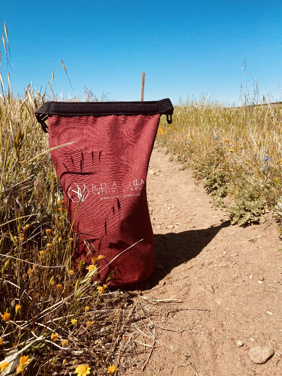 Adventure Bag containing essential outdoor protection and hydration products, designed for outdoor enthusiasts.