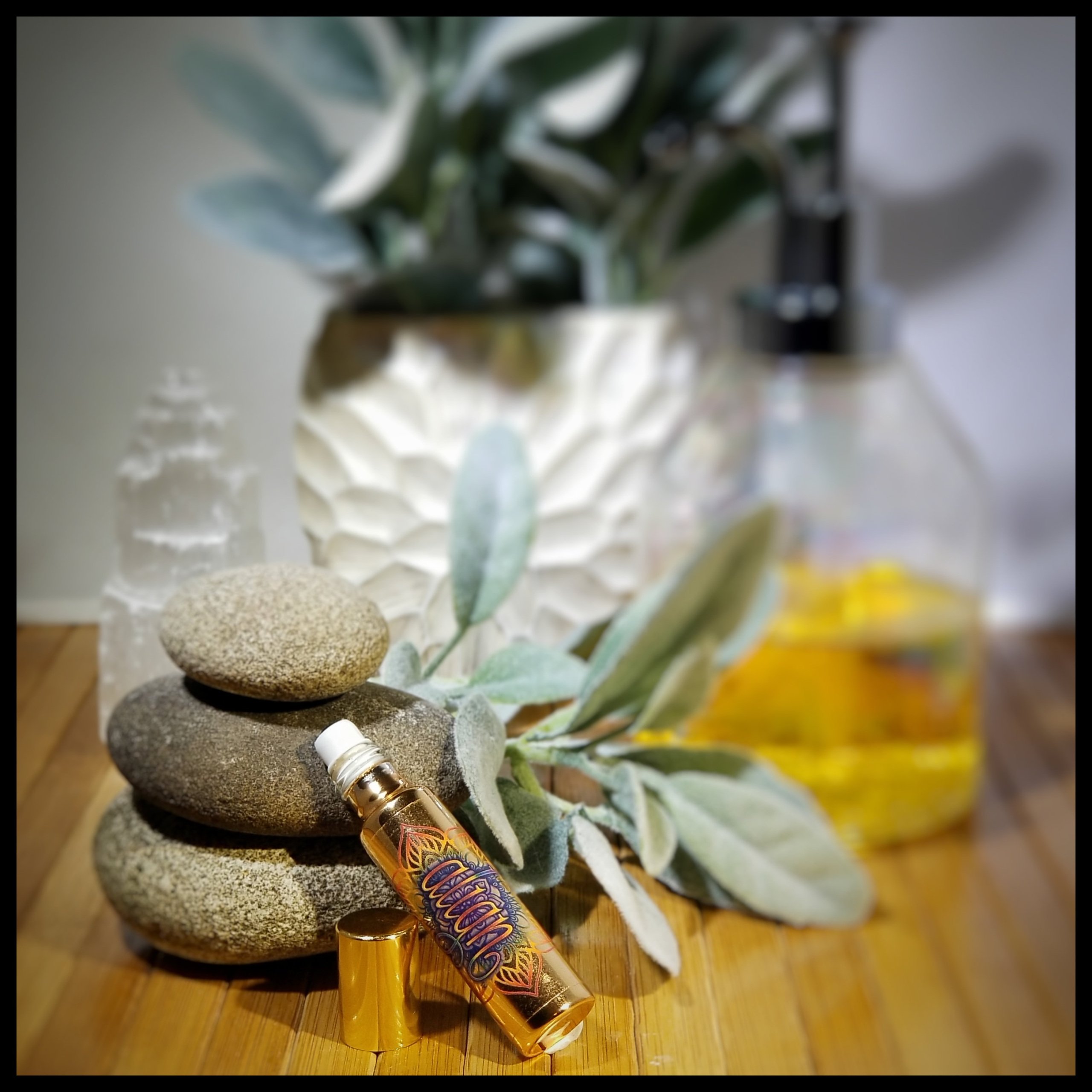 Align Essential Oil Roll-On in a stylish metallic glass bottle, designed for chakra balancing and energy alignment.