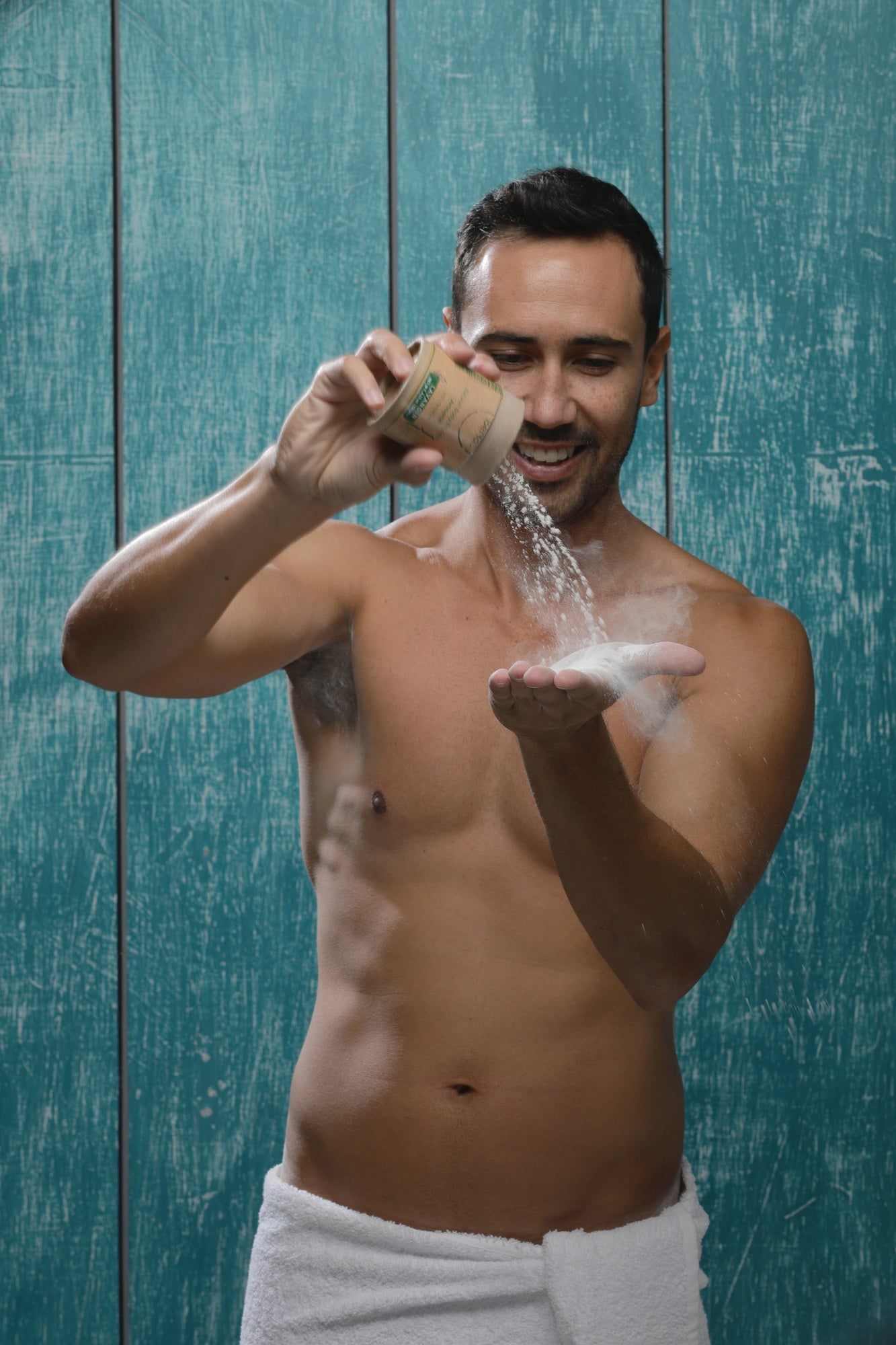 Eco-friendly All-Natural Body Powder in a cardboard tube with a recyclable sifter, showcasing its natural ingredients.