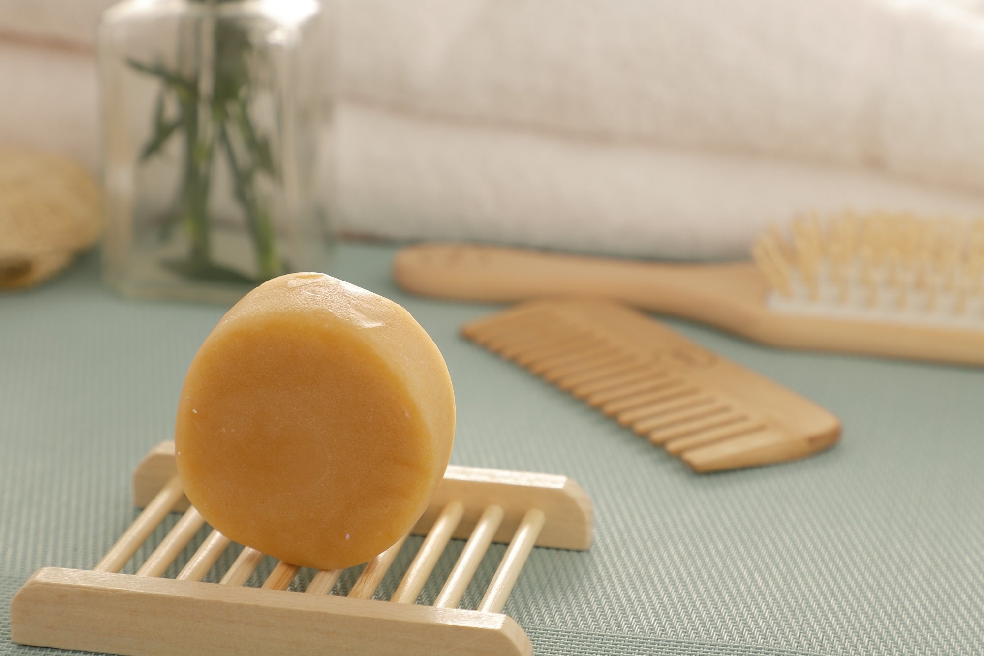 All-Natural Conditioner Bar in citrus scent, eco-friendly and zero-waste, showcasing its compact size and natural ingredients.