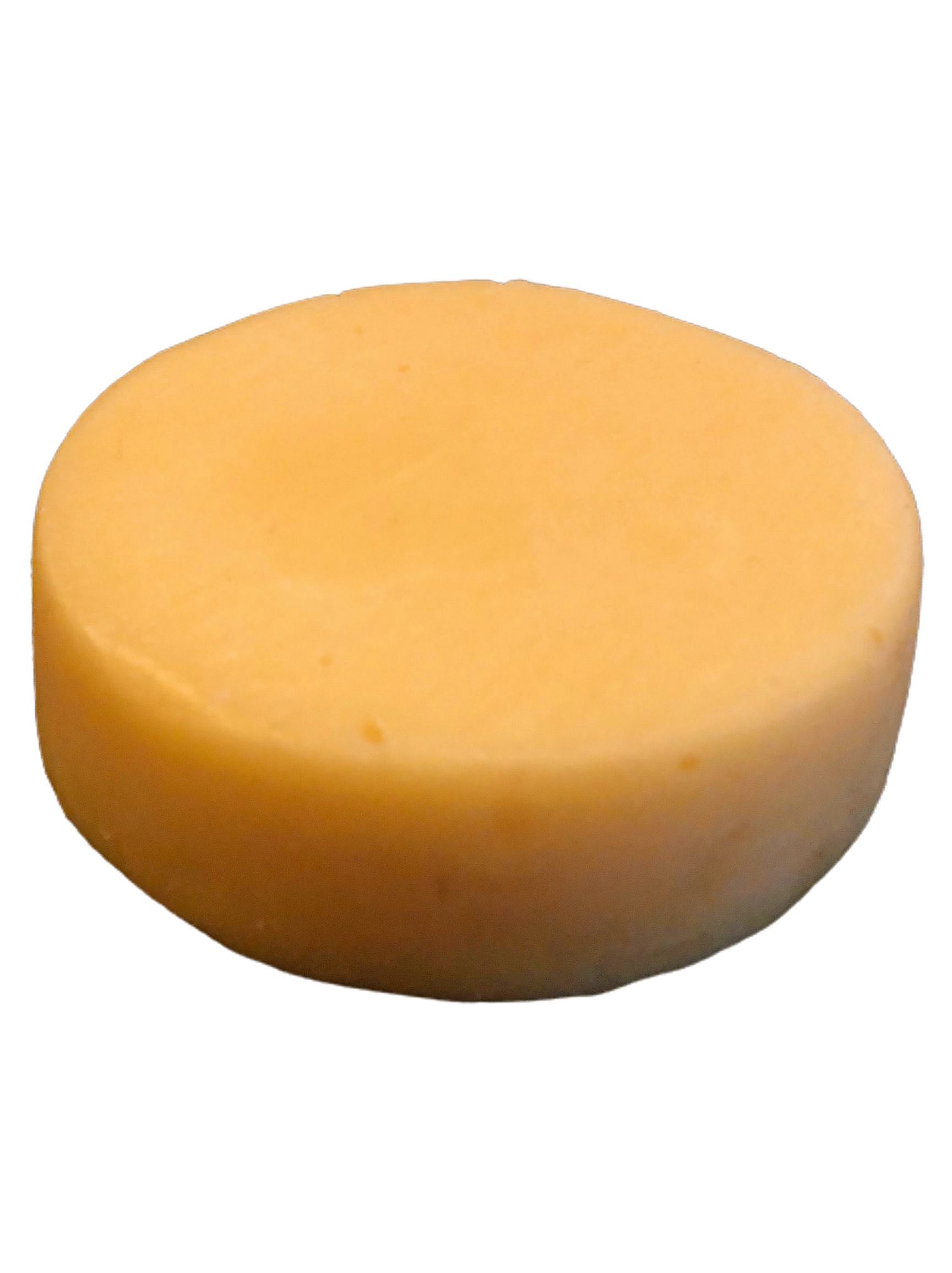 All-Natural Conditioner Bar in citrus scent, eco-friendly and zero-waste, showcasing its compact size and natural ingredients.