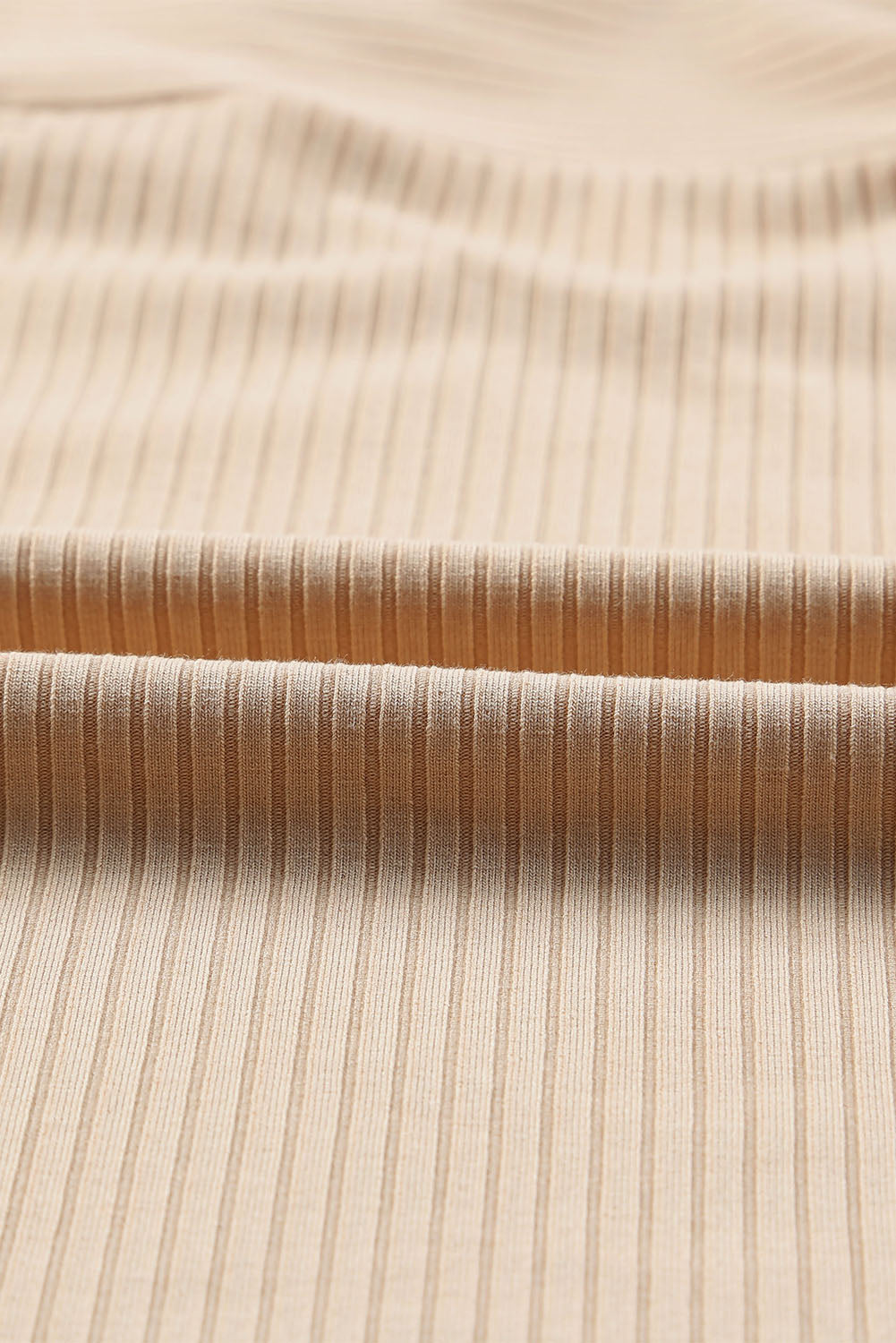 Apricot Cut Out Criss Cross Cold Shoulder Ribbed Top showcasing stylish design and ribbed texture.