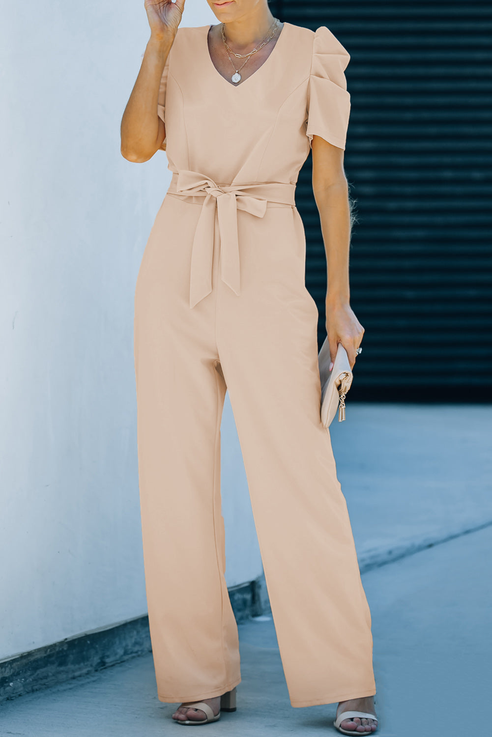 Apricot straight leg jumpsuit with knotted high waist and short sleeves, showcasing a stylish v-neck design.