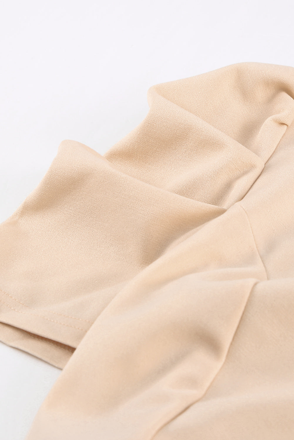 Apricot straight leg jumpsuit with knotted high waist and short sleeves, showcasing a stylish v-neck design.