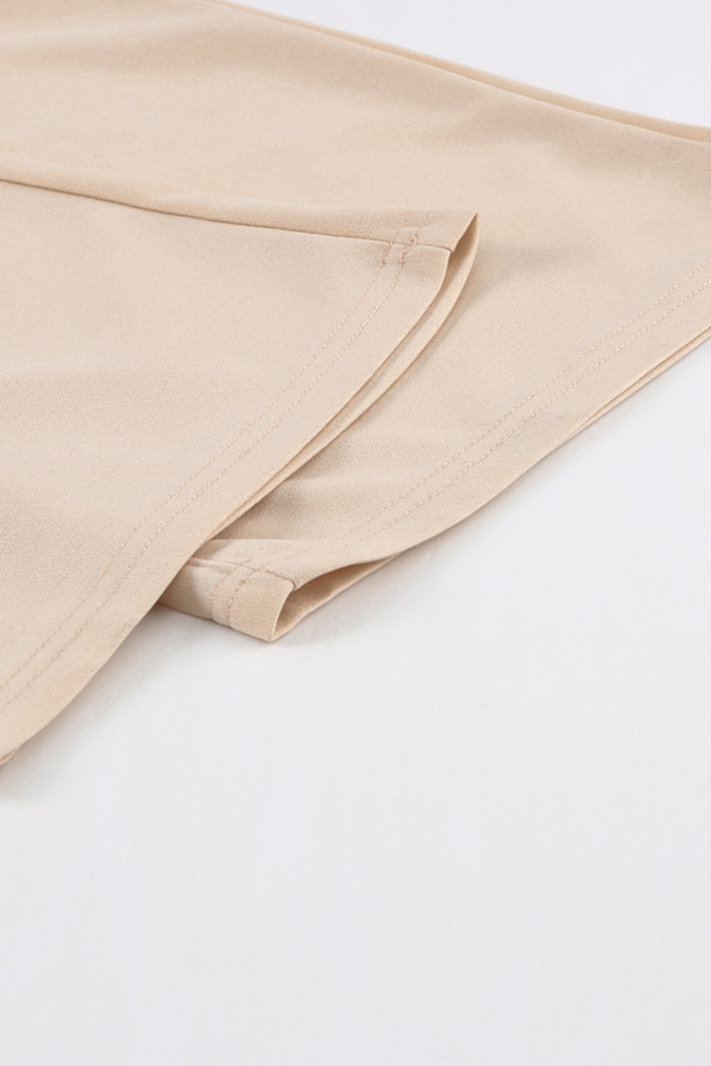 Apricot straight leg jumpsuit with knotted high waist and short sleeves, showcasing a stylish v-neck design.