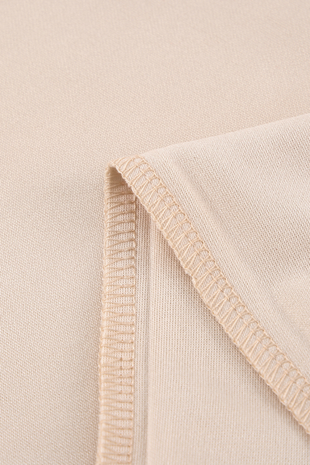 Apricot straight leg jumpsuit with knotted high waist and short sleeves, showcasing a stylish v-neck design.