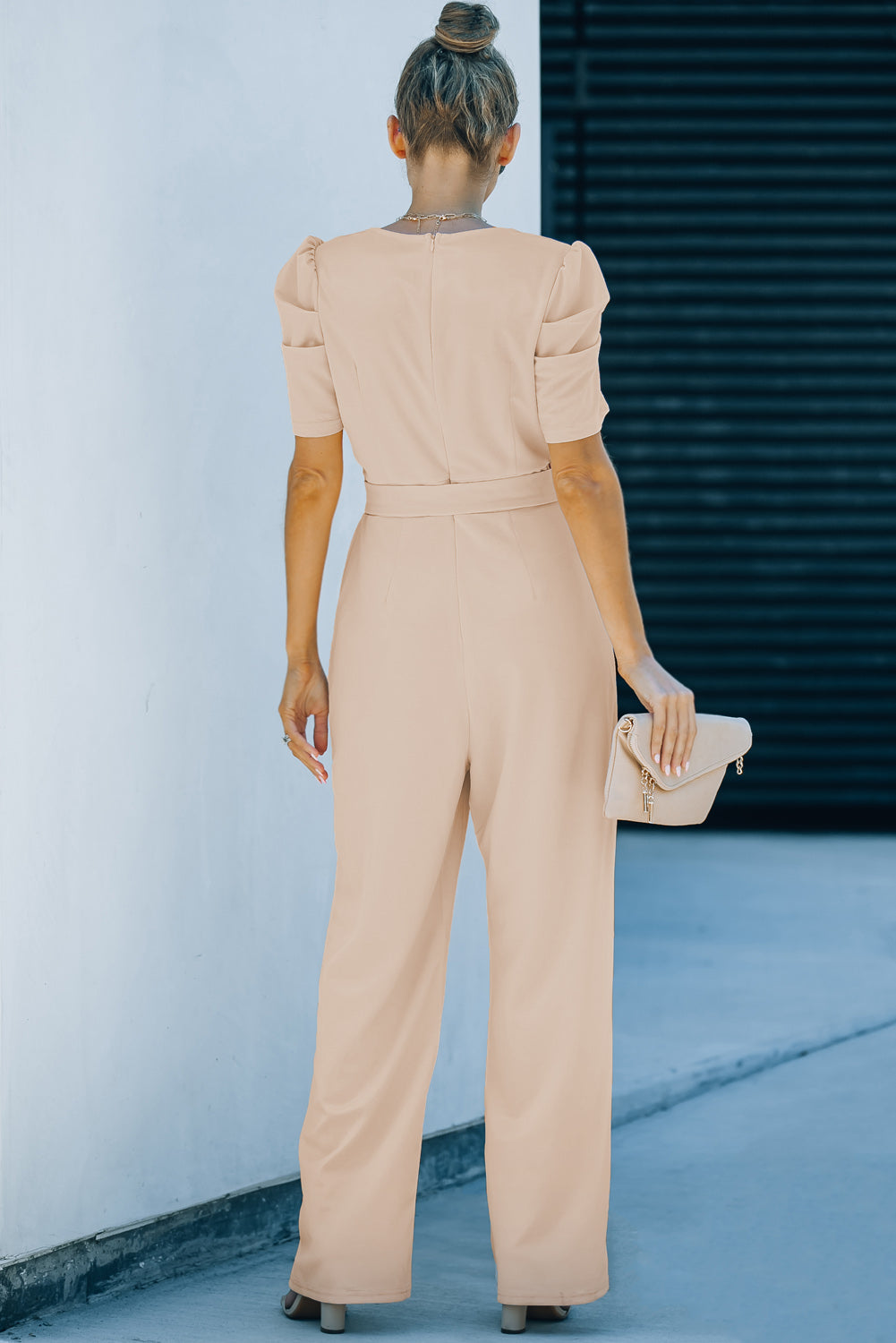Apricot straight leg jumpsuit with knotted high waist and short sleeves, showcasing a stylish v-neck design.