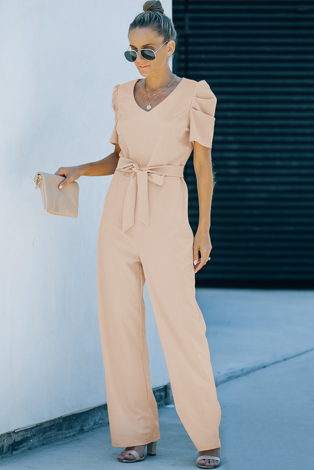 Apricot straight leg jumpsuit with knotted high waist and short sleeves, showcasing a stylish v-neck design.