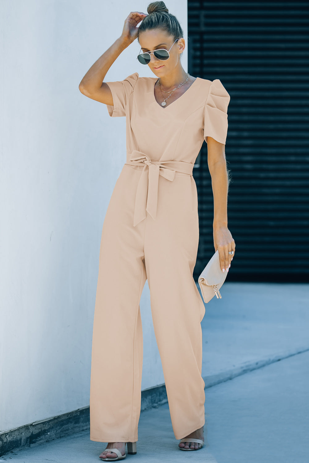 Apricot straight leg jumpsuit with knotted high waist and short sleeves, showcasing a stylish v-neck design.
