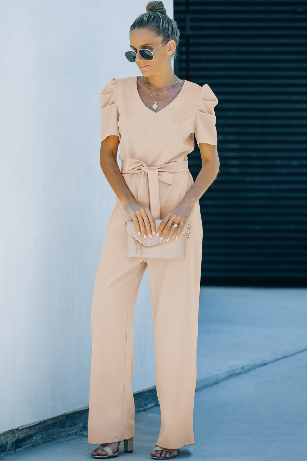 Apricot straight leg jumpsuit with knotted high waist and short sleeves, showcasing a stylish v-neck design.
