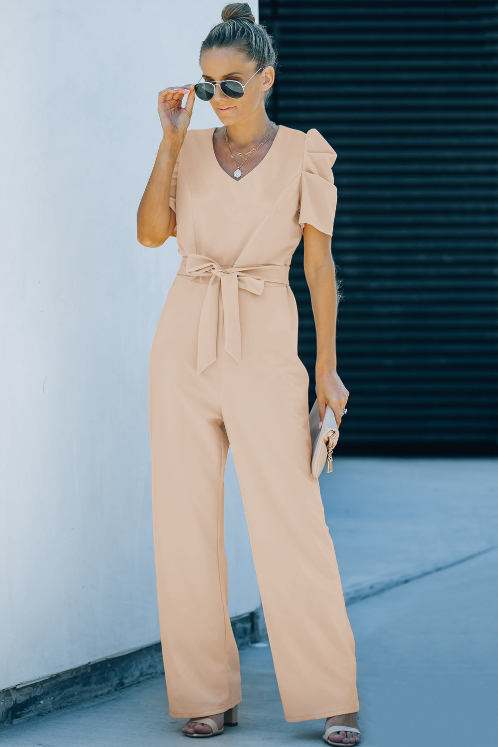 Apricot straight leg jumpsuit with knotted high waist and short sleeves, showcasing a stylish v-neck design.