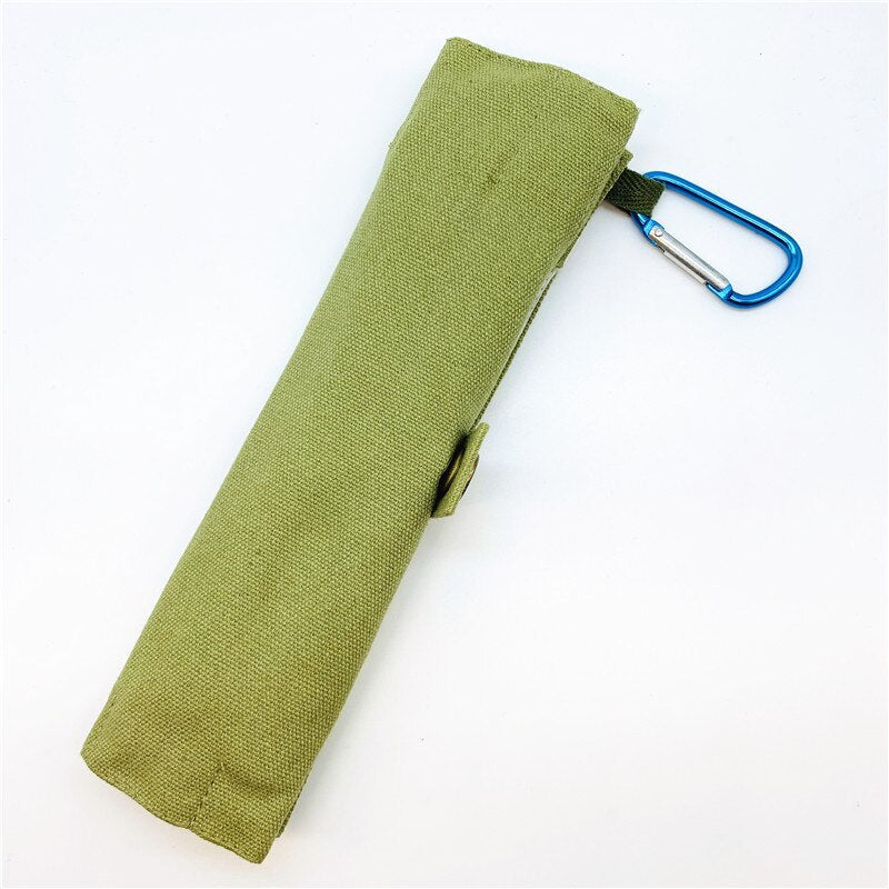 A complete set of bamboo travel utensils including a spoon, fork, knife, chopsticks, straw, and cleaning brush in a stylish pouch.