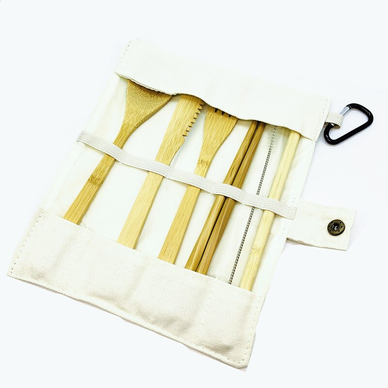 A complete set of bamboo travel utensils including a spoon, fork, knife, chopsticks, straw, and cleaning brush in a stylish pouch.