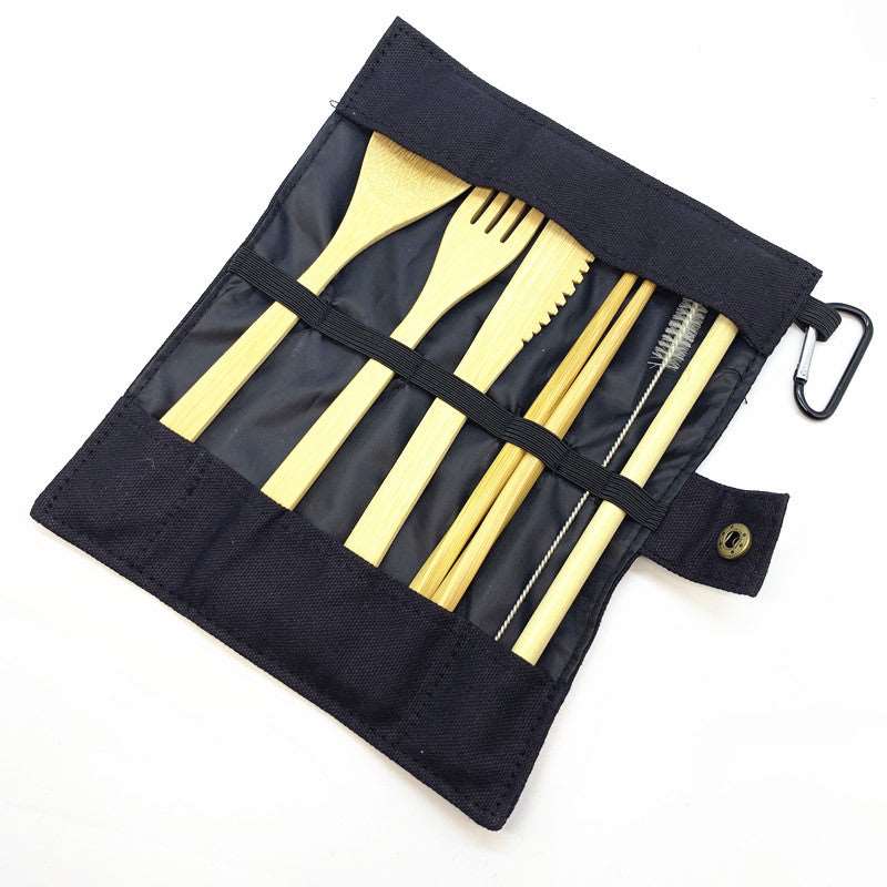A complete set of bamboo travel utensils including a spoon, fork, knife, chopsticks, straw, and cleaning brush in a stylish pouch.
