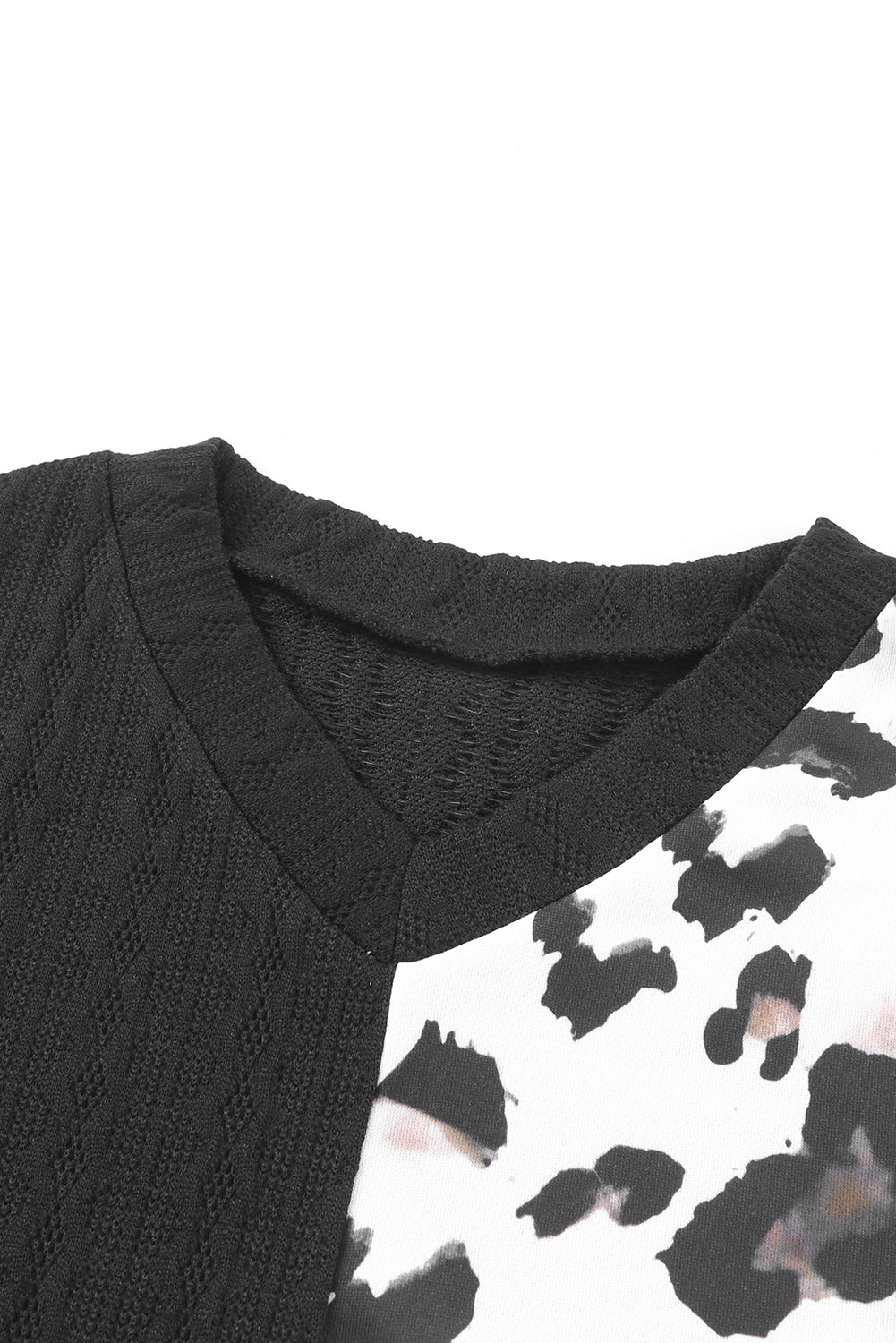 Black Asymmetric Leopard Patchwork Wide Sleeve V Neck Sweater showcasing a stylish design with leopard print splicing and wide sleeves.