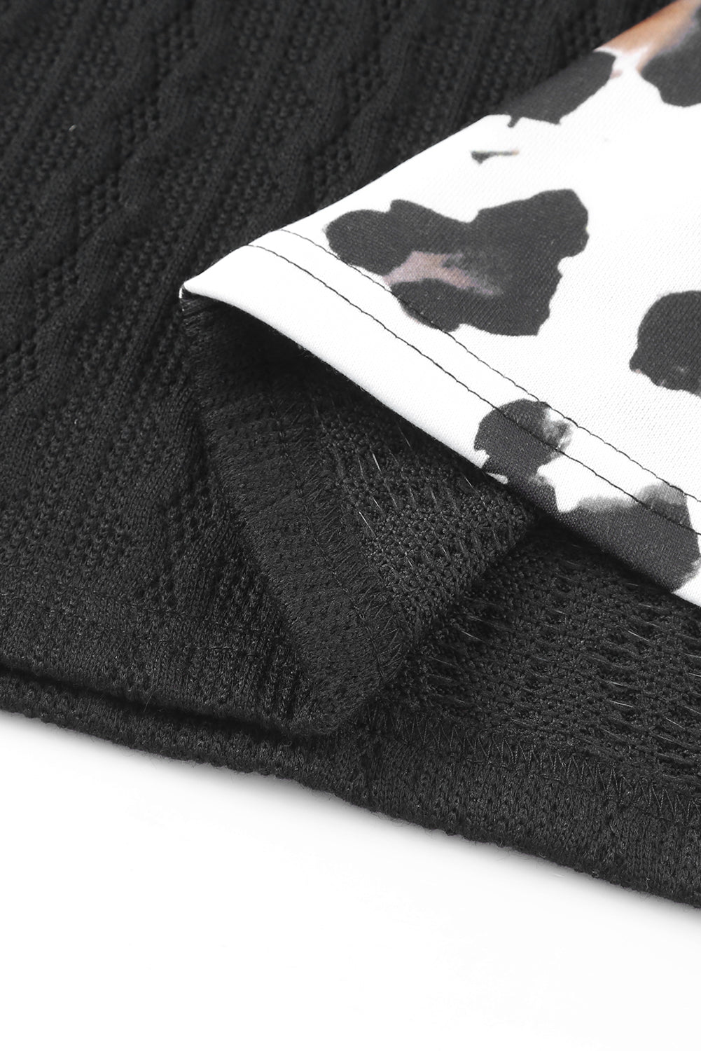 Black Asymmetric Leopard Patchwork Wide Sleeve V Neck Sweater showcasing a stylish design with leopard print splicing and wide sleeves.